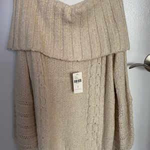 Off the shoulder ivory sweater.